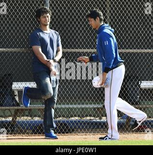 NISHINOMIYA, Japan - Farsad Darvish (L) and his wife Ikuyo (C), parents of  Tohoku High Schools ace Yu Darvish,who would later become pro club Nippon  Ham Fighters pitcher, root for their son