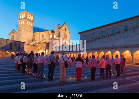 Europe,Italy,Umbria, Perugia district,Assisi Moment of prayer in the square of the Church of Saint Francis of Assisi Stock Photo
