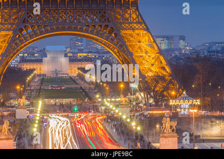 Close-up view of Eiffel Tower with Ecole Militaire beyond in Paris city at dusk. Paris, Île-de-France, France, Europe Stock Photo