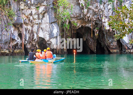 Puerto Princesa, Philippines. Visitors enter the Subterranean River in Puerto Princessa.The Underground River is one of the New 7 Wonders of Nature. Stock Photo