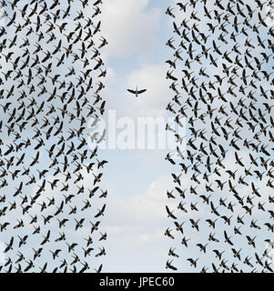 Concept of individualism and Individuality symbol or independent thinker idea and new leadership concept or individual courage as a group of birds. Stock Photo