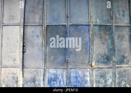 Vintage and old blue metal door with rectangular pattern Stock Photo