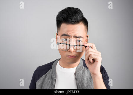 Portrait of cool handsome asian man with arms crossed Stock Photo