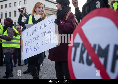 An American expat holding an anti-Trump placard in front of the US embassy before doing a speech in front of the crowd in Berlin on November 12 2016 Stock Photo