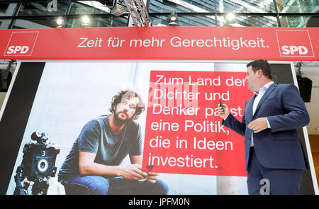 Berlin, Germany. 1st Aug, 2017. Hubertus Heil, the general secretary of the SPD, presents the party's electoral campaign posters in Willy Brandt House in Berlin, Germany, 1 August 2017. Photo: Kay Nietfeld/dpa/Alamy Live News Stock Photo
