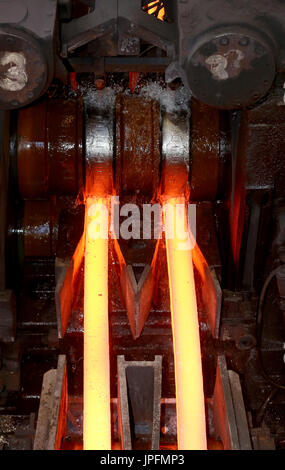 A rolling mill in a metallurgical plant of the ArcelorMittal Ostrava is seen during an extremely hot day in Ostrava, Czech Republic, on August 1, 2017. At the time of heat, workers working in ArcelorMittal Ostrava's hot factories are exposed to excessive working temperatures. In the rolling mill operation its hot stamped plates with a temperature of up to 1200 degrees of Celsius. Employees therefore have a more frequent break mode that they can spend in air-conditioned areas. The company also provides them with more beverages. (CTK Photo/Petr Sznapka) Stock Photo