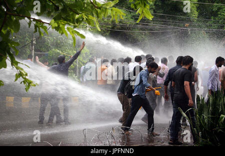 Police officials restore baton charge and open water canon to repel protesters moving towards Red Zone during protest demonstration of Young Doctors Association (YDA) against Secretary Heath Department, near Governor House at Mall road in Lahore on Tuesday, August 01, 2017. Stock Photo