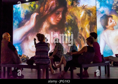 Berlin, Germany, 1st August 2017. People enjoy a multimedia video art show ‘From Monet to Kandinsky.Visions Alive’ . The exhibition presents the works of 16 Modernist artists on 7 meter screens placed at different angles in two viewing rooms. Credit: Eden Breitz/Alamy Live News Stock Photo
