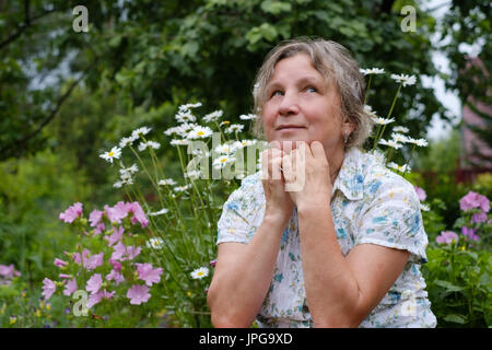 close up portrait of mature caucasian woman dreaming Stock Photo