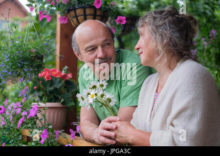 Cheerful senior couple enjoying life at countryside house Stock Photo
