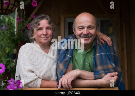 Cheerful senior couple enjoying life at countryside house Stock Photo