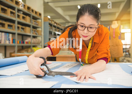 Drawing woman in cutout dress on sheet of paper on nature background Stock  Photo - Alamy