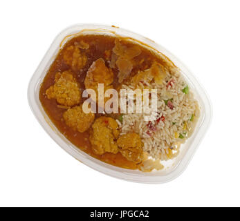 Top view of a frozen chicken nugget TV dinner in a microwavable plastic tray isolated on a white background. Stock Photo