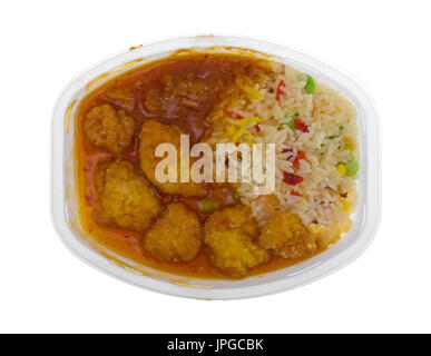 Top view of a cooked chicken nugget TV dinner in a microwavable plastic tray isolated on a white background. Stock Photo