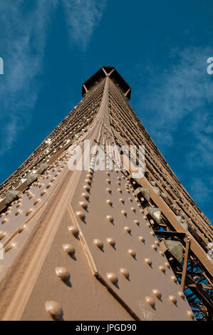 Looking up towards the top of the Eiffel Tower with close up details of the wrought iron lattice structure. Paris, France. Stock Photo