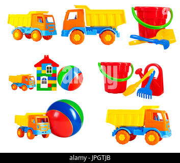 bright multi-colored toys for children isolated on a white background, a set. toys - machine truck, a ball, a toy house, a bucket, a rake, a shovel, a Stock Photo