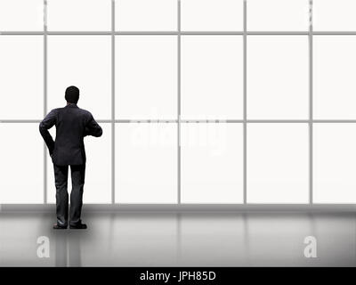 rear view of businessman standing alone in office Stock Photo