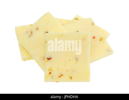 Small group of fresh pepper jack cheese squares isolated on a white background. Stock Photo