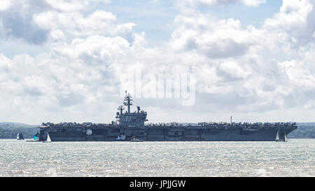 The USN aircraft carrier USS George H W Bush anchored in the Solent during a visit to the UK Stock Photo