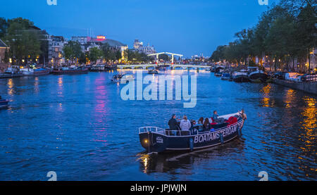 Evening view over famous Amstel River in the city of Amsterdam - AMSTERDAM - THE NETHERLANDS 2017 Stock Photo