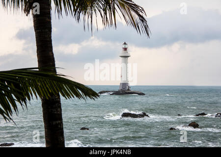 View of a lighthouse in the Dongtian park, Sanya, Hainan, China and palm trees Stock Photo
