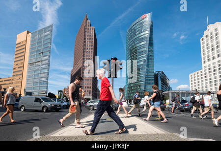 Pedestrian crossing and cityscape of Potsdamer Platz modern business and entertainment district in Berlin, Germany Stock Photo