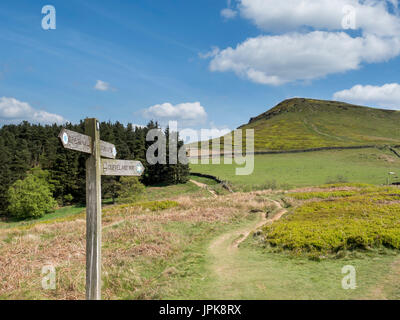 A wooden sighpost points the way up the hill to follow the Cleveland Way. Stock Photo
