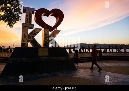 Kota Kinabalu, Malaysia - August 01, 2017: Back lit of the new landmark 'I LOVE KK' at sunset.The city’s new landmark at Segama Waterfront built to fu Stock Photo