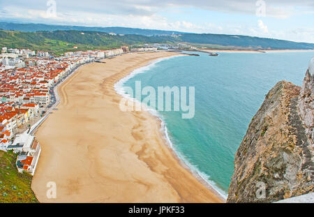 The sand beach of Praia district is seen from the hilltop of Nazare, Costa de Prata (Silver Coast), Portugal. Stock Photo