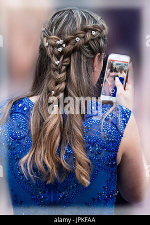 Teenage Girls Attending The High School Prom All Dressed Up In