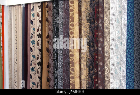 Colorful upholstery patterns samples materials on display wall Stock Photo