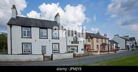 Panoramic view of row of buildings on main street of coastal village of Ravenglass, Cumbria, England Stock Photo