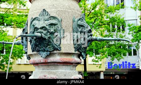 Fountain with Myth crafts, statues, in old town Ulm, Germany Stock Photo