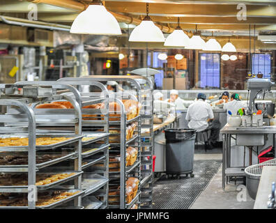 Bakery workers taking a coffee break at a Chelsea Market bakery in Manhattan. Stock Photo