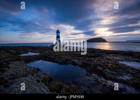 Sunrise at Penmon Lighthouse, Penmon Point Anglesey Wales UK Stock Photo