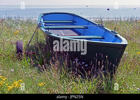 Beached dinghy. Boulmer, Northumberland, United Kingdom, Europe. Stock Photo