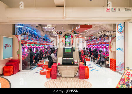 TOKYO, JAPAN - 8 JANUARY 2017 - Pachinko Parlor in Akihabara. It's a type of mechanical arcade game originating in Japan widely used as a recreational Stock Photo