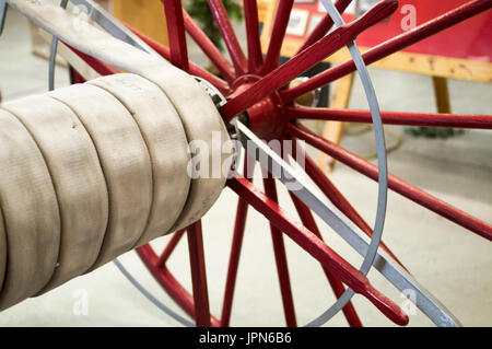 A vintage fire fighter hose on display at a firefighter museum. Stock Photo