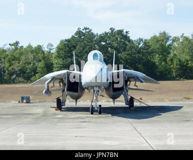 An f-14 tomcat jet on display on a concrete tarmac. Stock Photo