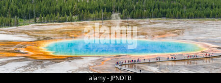 Tourists line the boardwalk at the Grand Prismatic Spring in Midway Geyser Basin in Yellowstone National Park, Wyoming.