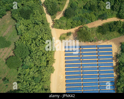 Solar energy farm in natural background aerial above drone view Stock Photo