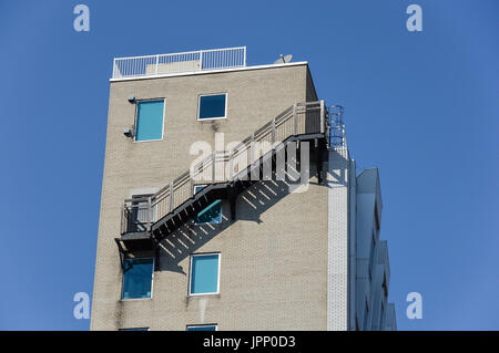 Fire escape ladder on modern building in Montreal downtown, QC, Canada Stock Photo