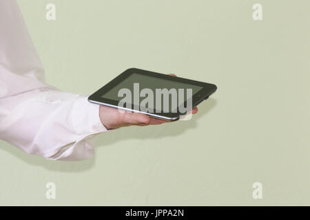Business concept of gadgets. The man is holding a tablet in his hands. Photo for your design Stock Photo