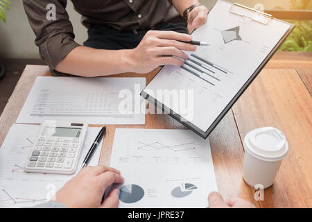 Business meeting  in outdoor. documents account managers crew working with new startup project Idea presentation, analyse marketing plans. Stock Photo