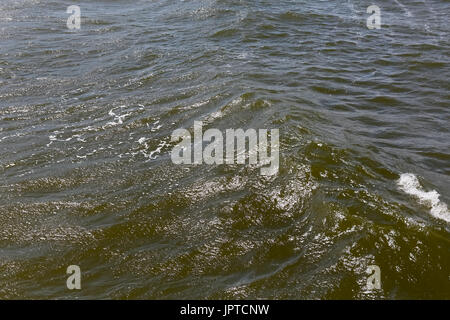 Wavy waters of Baltic sea that can be seen close to seashore during windy day in Kolobrzeg in Poland Stock Photo