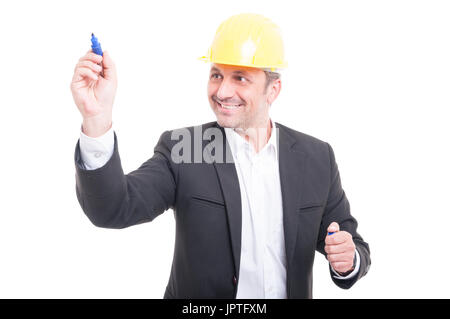 Architect wearing hardhat writing with marker and smiling isolated on white background Stock Photo