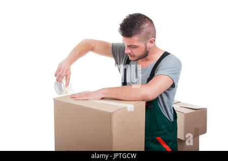 Mover guy using duct tape on cardboard box like packing isolated on white background Stock Photo