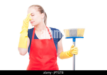 Attractive young cleaner showing like sign and cleaning the window on white background Stock Photo