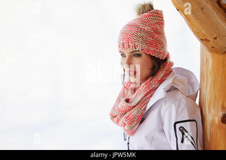 sport and people concept - happy young woman in ski cothes outdoors Stock Photo