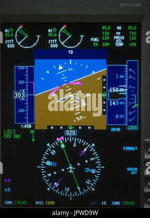 Rockwell Collins Pro Line 4 glass-cockpit cockpit-instruments, CRT primary-flight-display PFD with artificial-horizon and radio-compass direction indi Stock Photo